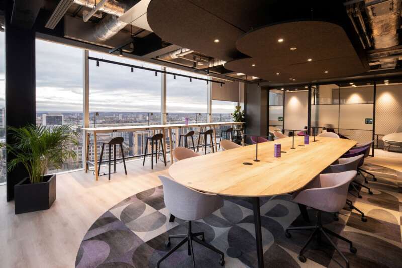 Combining Industrial Ceiling with Modern Lighting for Business Spaces